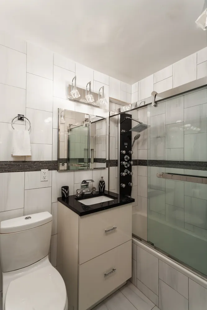 a bathroom with a sink toilet and shower