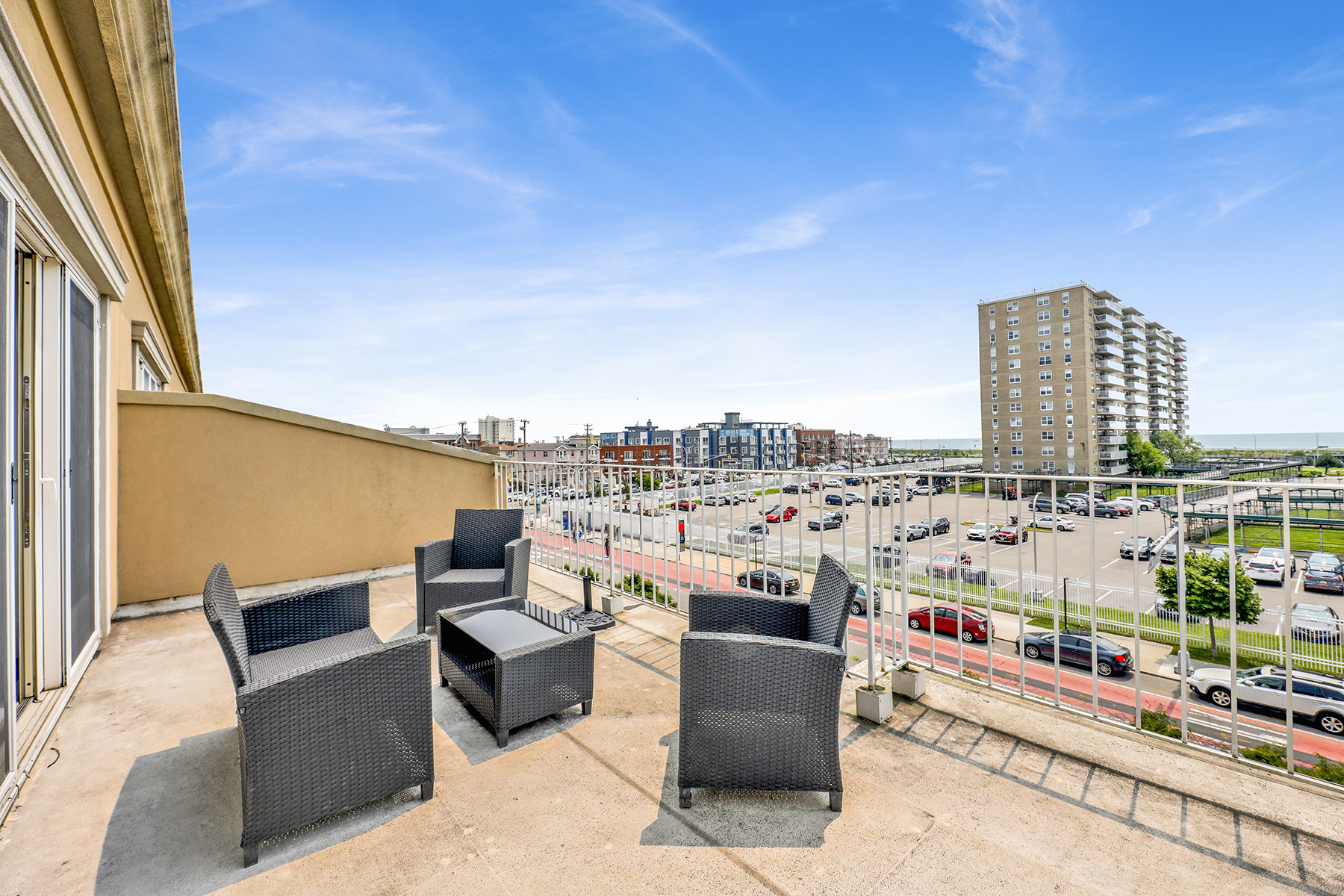 102-20 Rockaway Beach Boulevard, Unit 3C Queens, NY 11694 - Photo 28 of 36 a view of roof with potted plants and city view