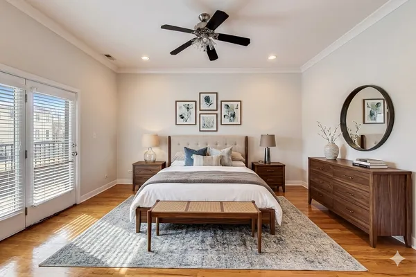 a bedroom with a bed a dresser and chair