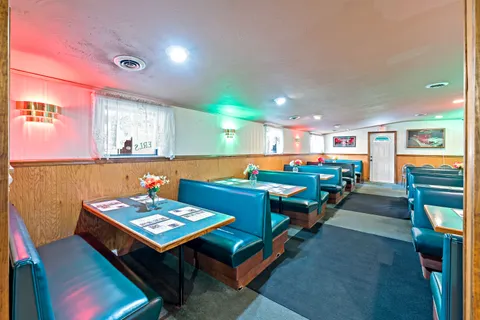 a room with furniture and air hockey table