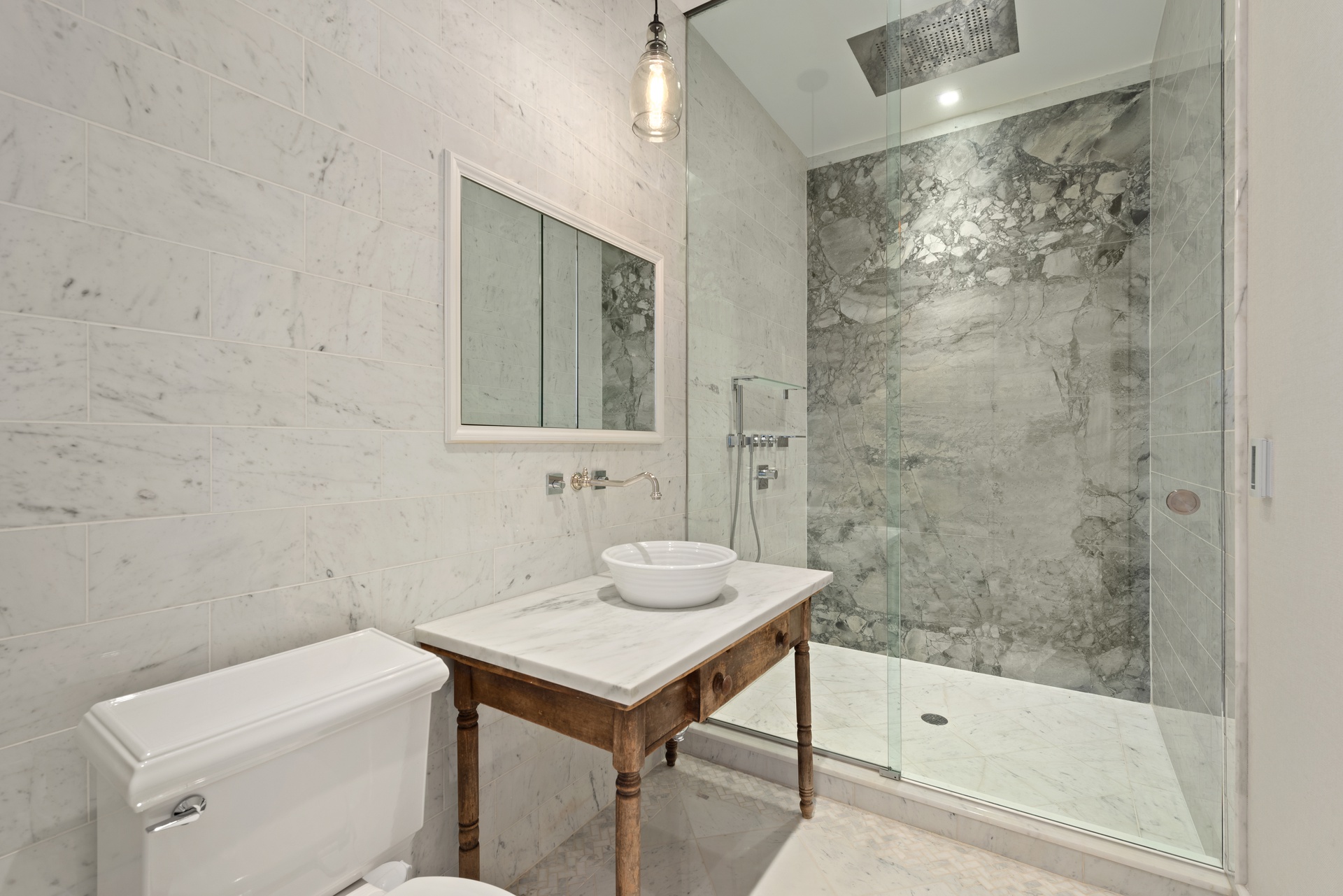 415 Washington Street, Unit 1B Manhattan, NY 10013 - Photo 9 of 16 a bathroom with a sink toilet and shower