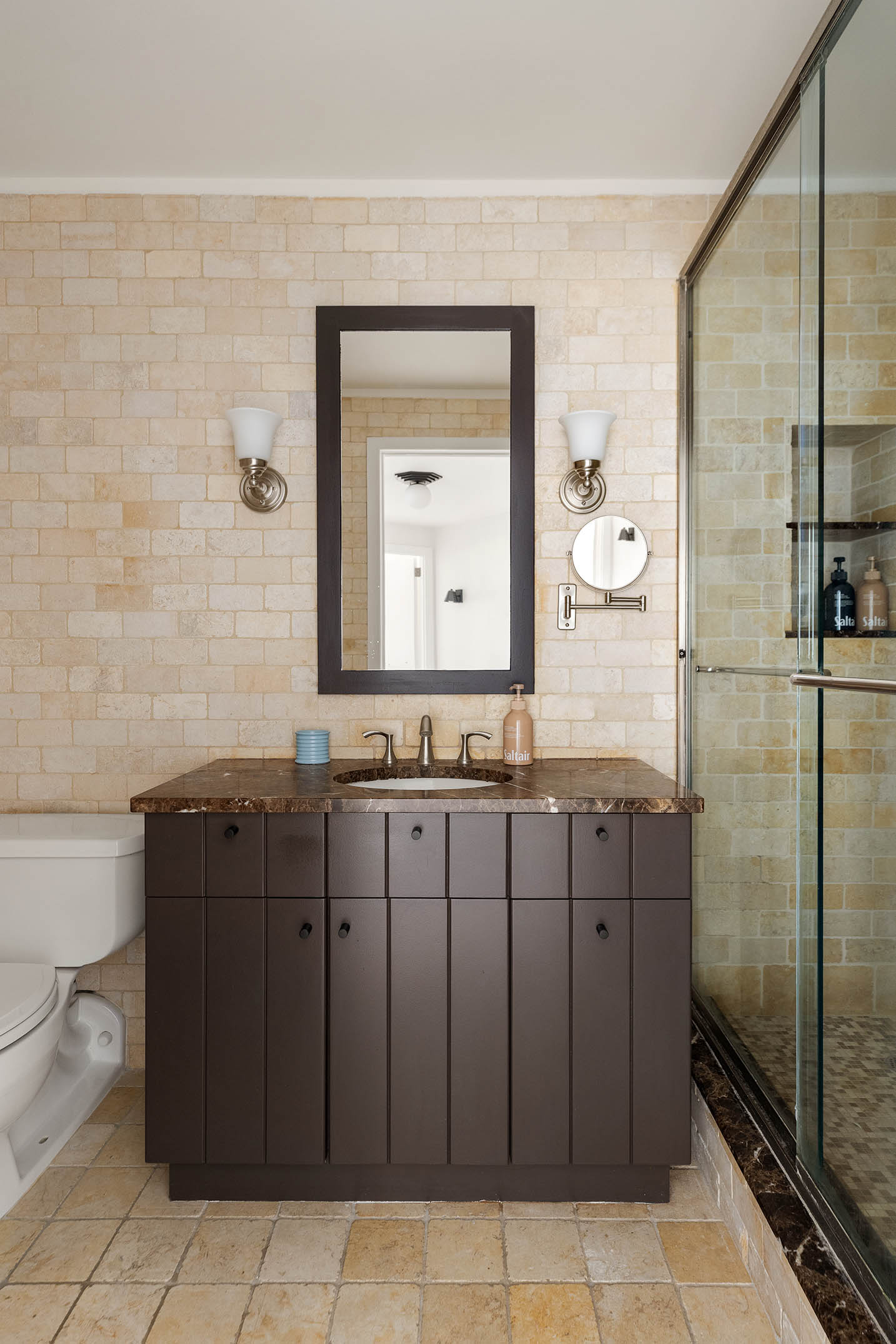 295 Greenwich Street, Unit 8/9H Manhattan, NY 10007 - Photo 16 of 22 a bathroom with a sink a mirror and a shower