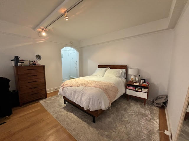 319 East 50th Street, Unit 10L Manhattan, NY 10022 - Photo 1 of 11 a bedroom with a bed and a dresser