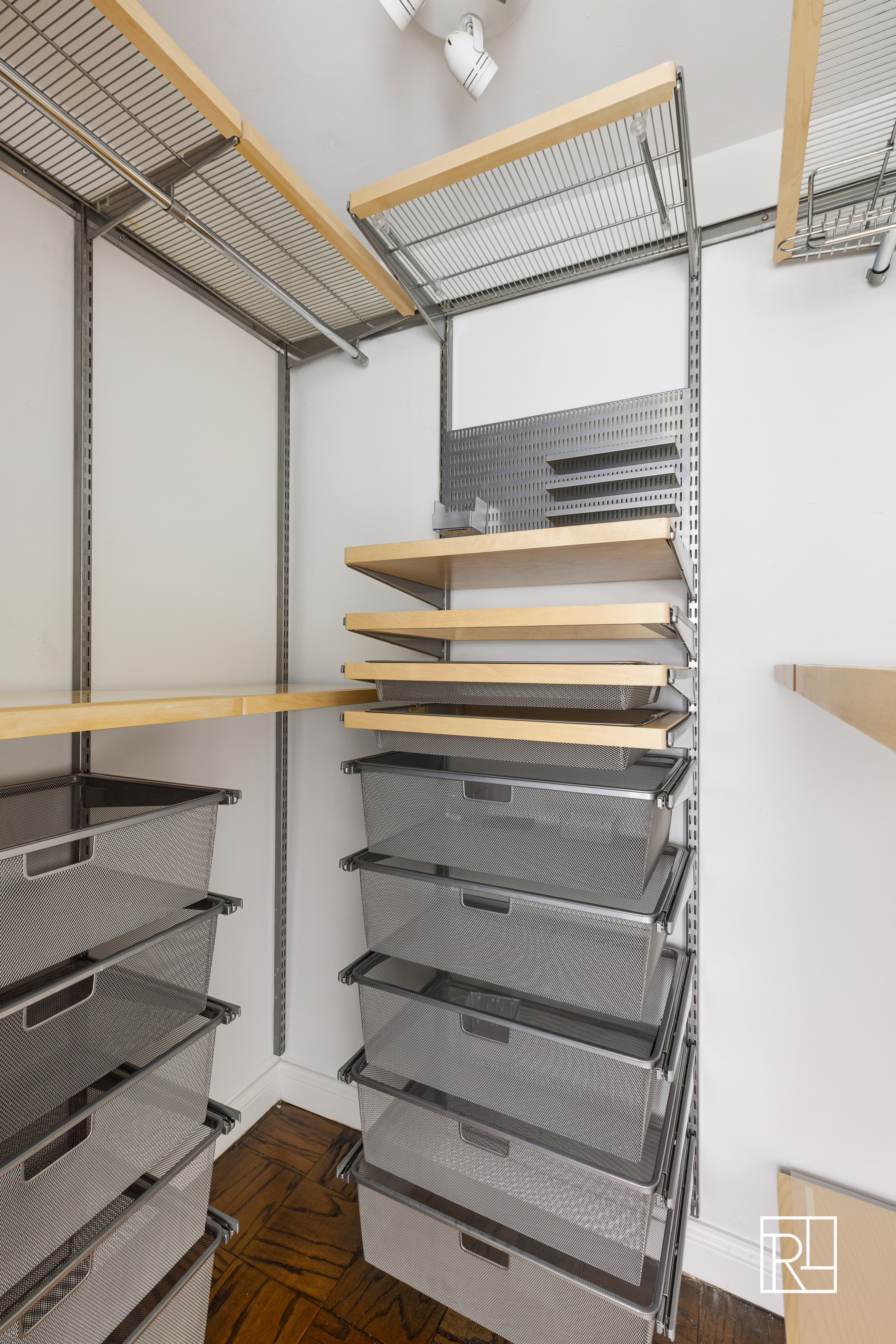 10 West 15th Street, Unit 403 Manhattan, NY 10011 - Photo 7 of 12 a view of closet with wooden floor