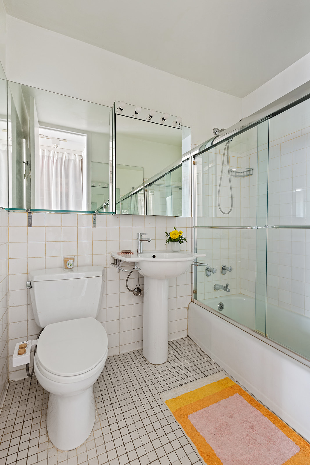 343 East 30th Street, Unit 12M Manhattan, NY 10016 - Photo 6 of 9 a bathroom with a sink a toilet and shower
