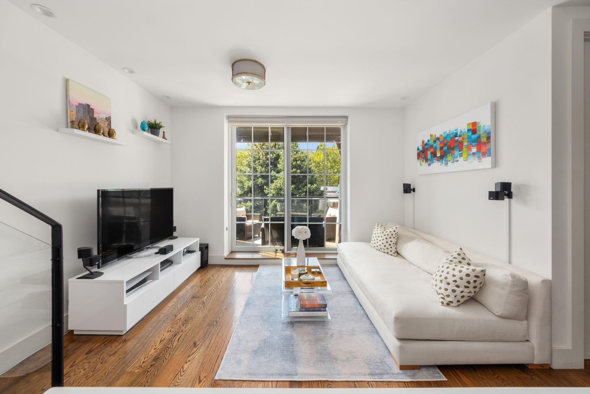 43 Newel Street, Unit PH2 Brooklyn, NY 11222 - Photo 2 of 10 a living room with furniture and a flat screen tv