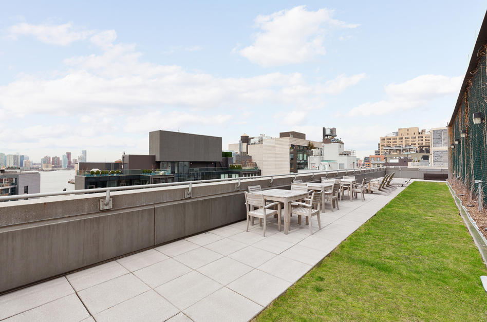 255 Hudson Street, Unit 9C Manhattan, NY 10013 - Photo 13 of 19 a view of a city from a terrace