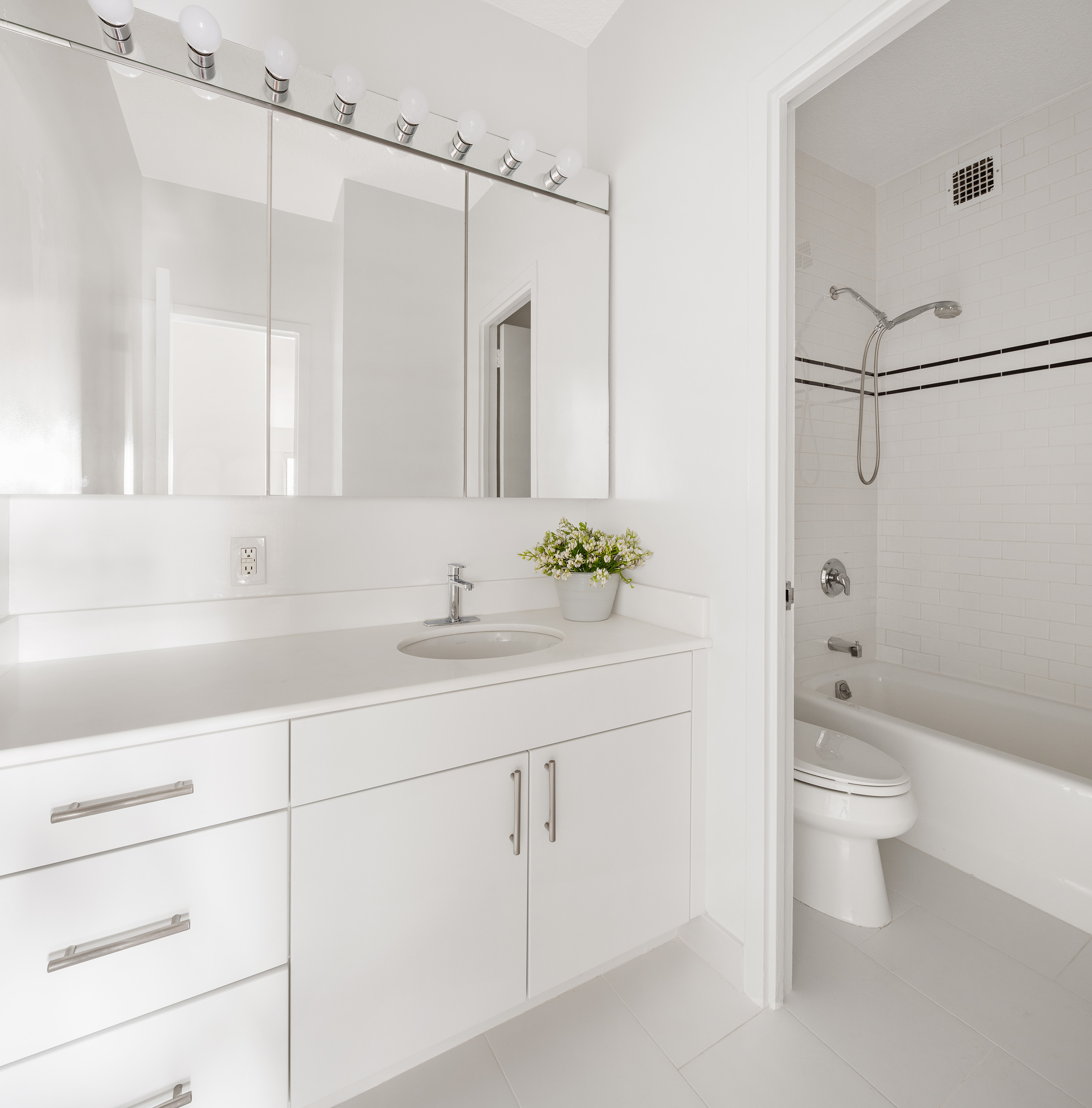 60 East 8th Street, Unit 10E Manhattan, NY 10003 - Photo 8 of 13 a bathroom with a granite countertop sink a toilet and shower