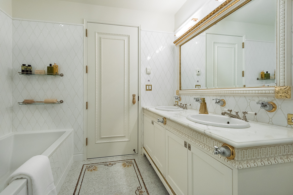 1 Central Park South, Unit 1801 Manhattan, NY 10019 - Photo 14 of 25 a bathroom with a sink vanity granite tub and shower