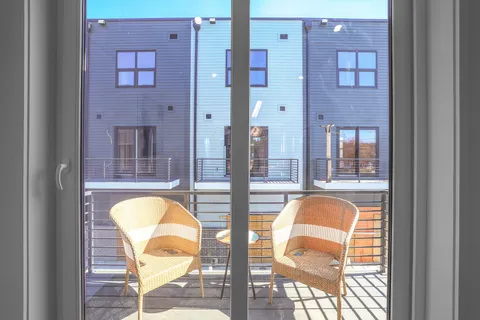 a swimming pool with a glass door and glass windows