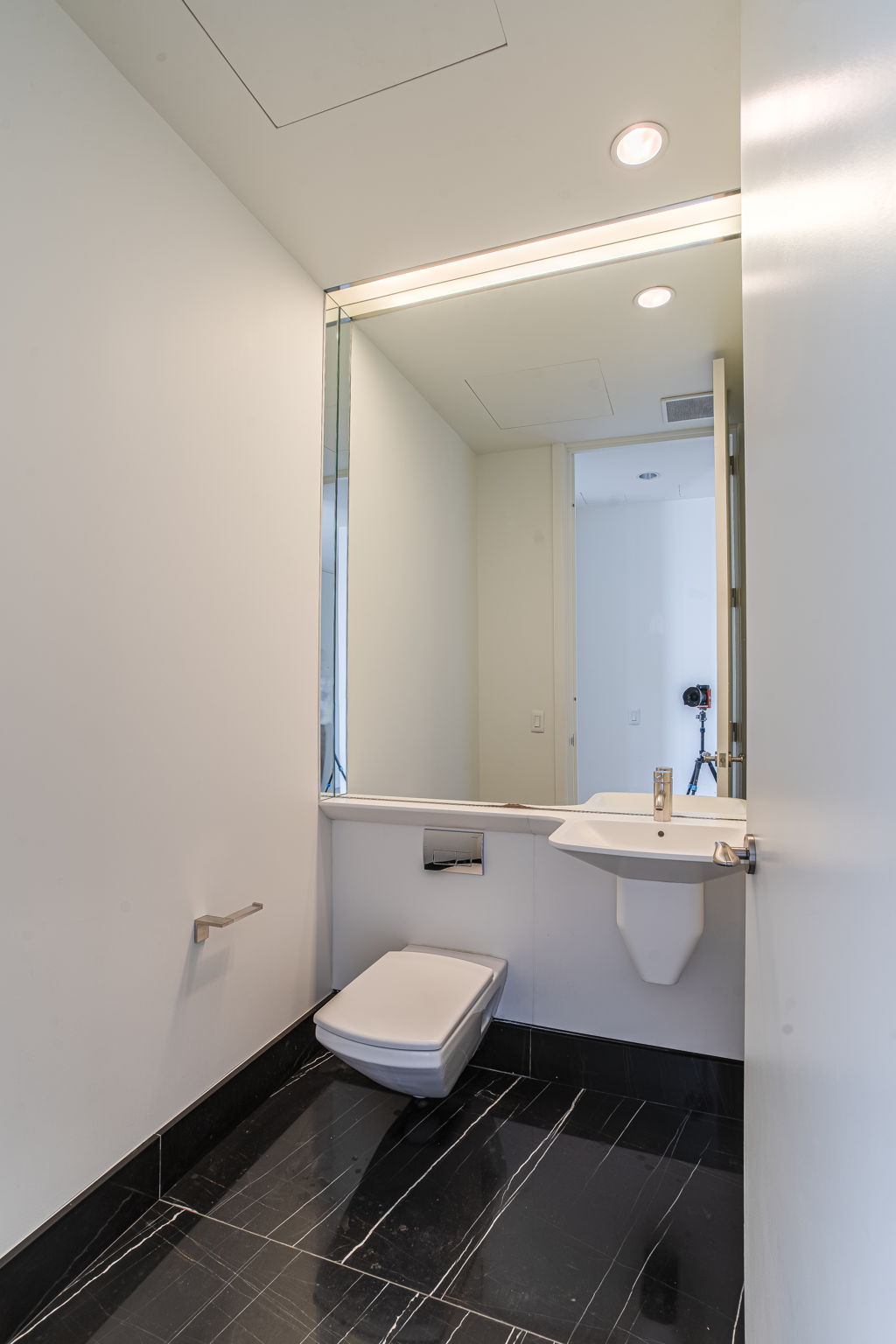 50 United Nations Plaza, Unit 26B Manhattan, NY 10017 - Photo 14 of 25 a bathroom with a sink and a mirror