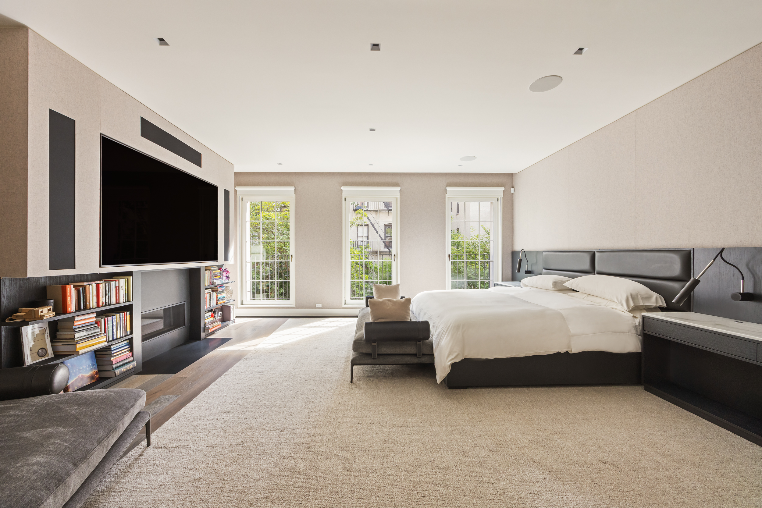 146 Waverly Place Manhattan, NY 10014 - Photo 21 of 41 a spacious bedroom with a bed and a flat screen television