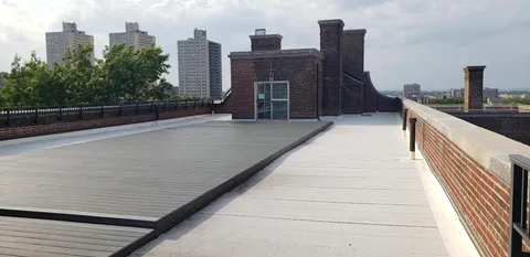 a view of balcony with furniture