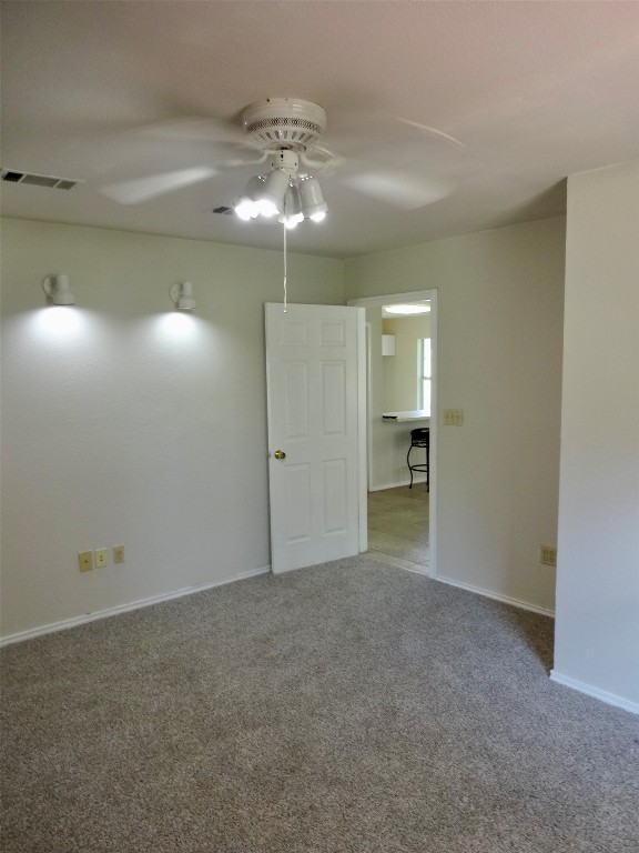 111 Trinity Street Cedar Creek, TX 78612 - Photo 35 of 38 a view of an empty room with a chandelier