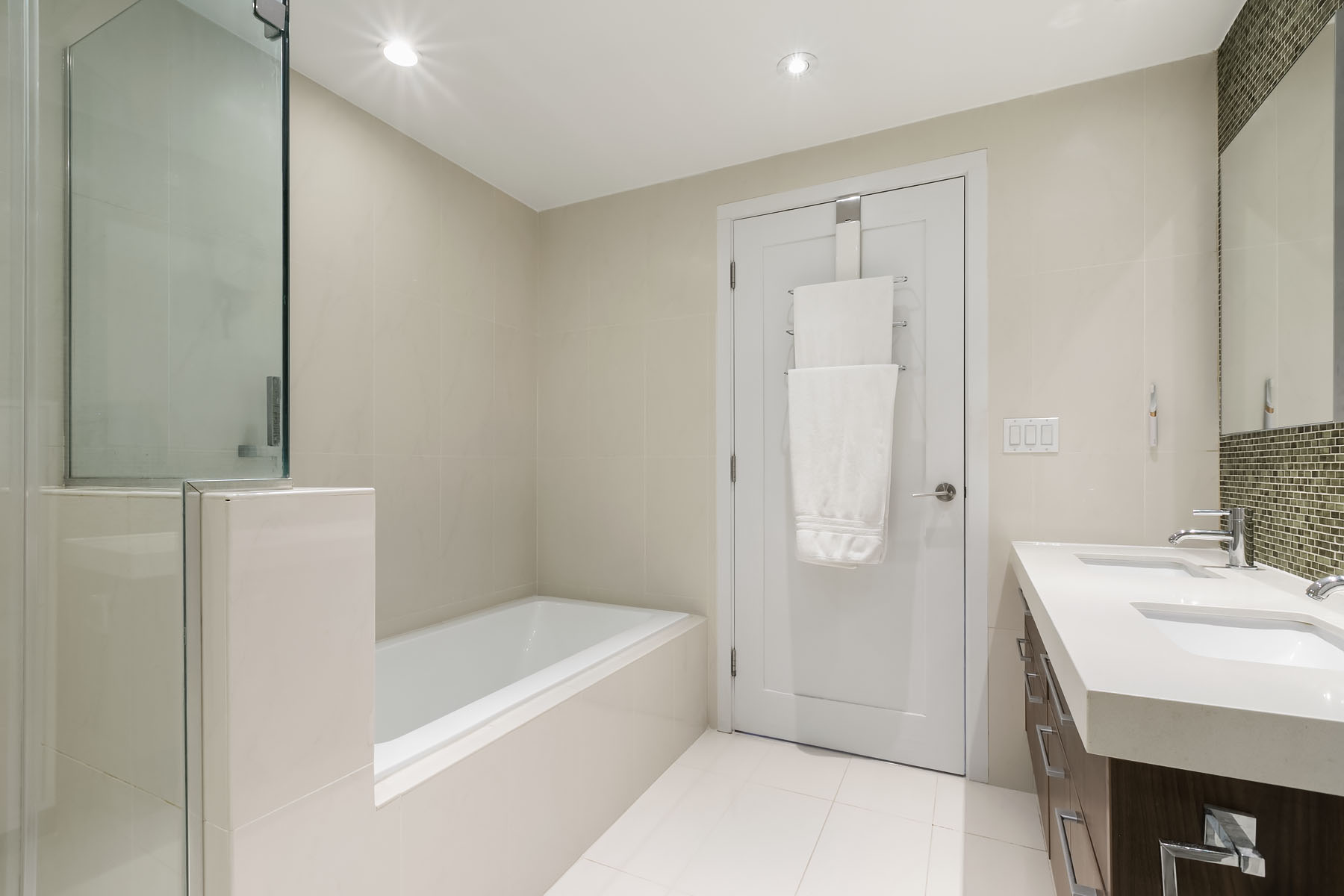 301 West 115th Street, Unit 6J Manhattan, NY 10026 - Photo 4 of 9 a bathroom with a bathtub a sink a vanity and a shower