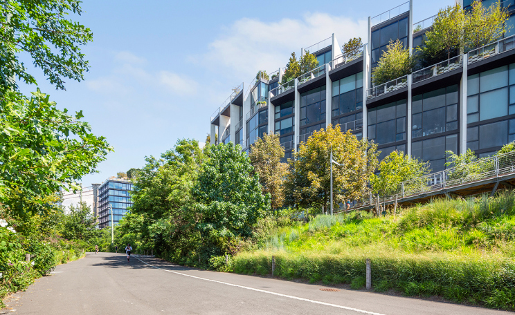 90 Furman Street, Unit N411 Brooklyn, NY 11201 - Photo 23 of 29 a front view of a house with a yard and potted plants