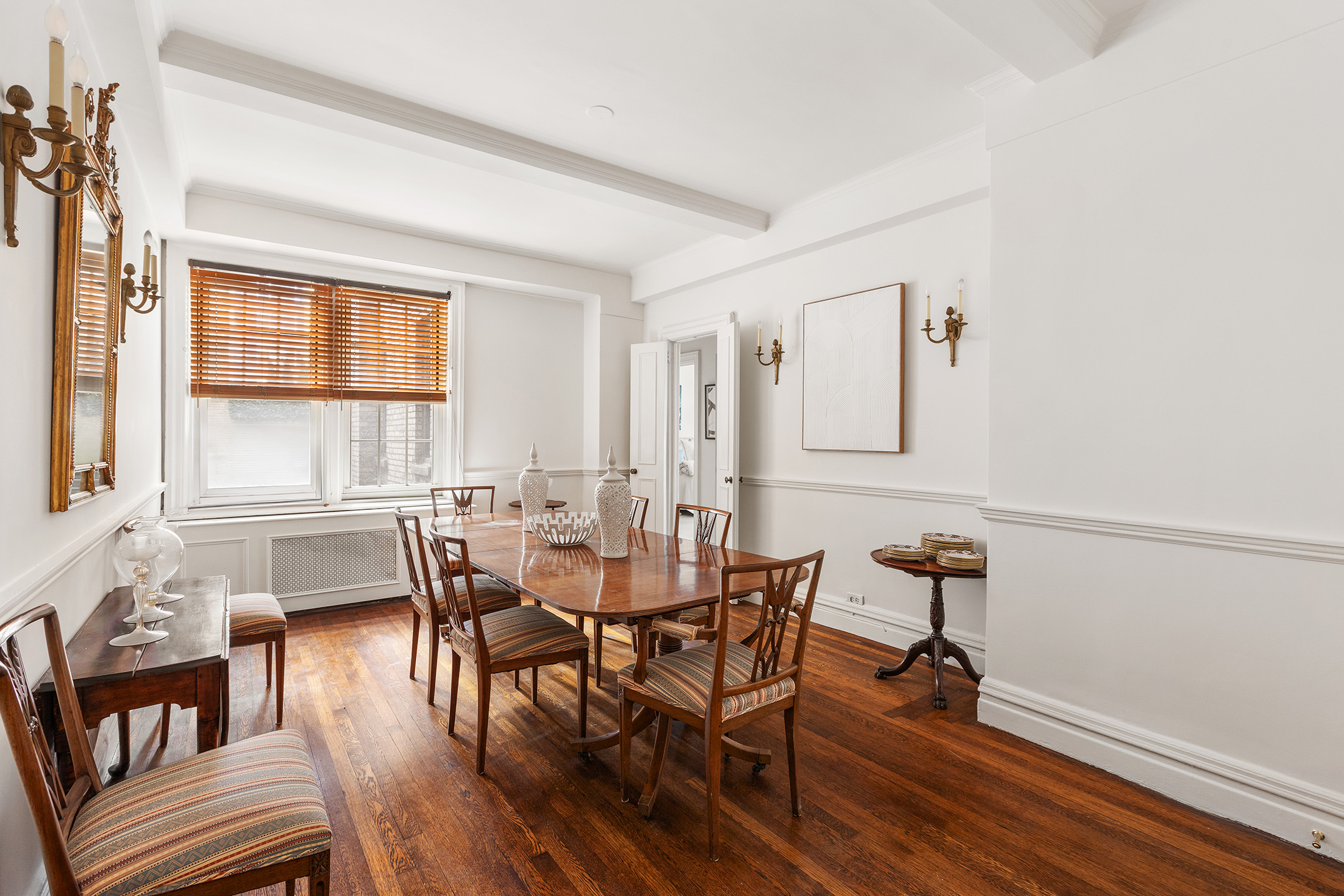 125 East 63rd Street, Unit 2B Manhattan, NY 10065 - Photo 4 of 12 a view of a a dining room with furniture window and wooden floor