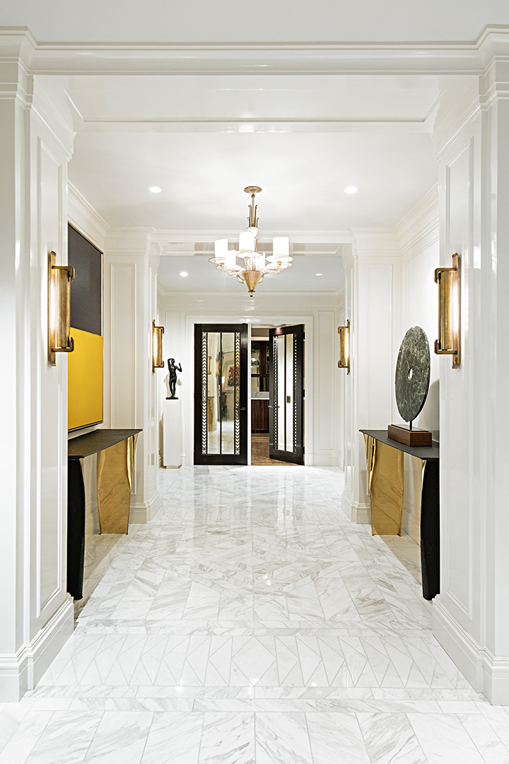 730 Park Avenue, Unit 7/8A Manhattan, NY 10021 - Photo 2 of 26 a view of a kitchen with a sink and a chandelier