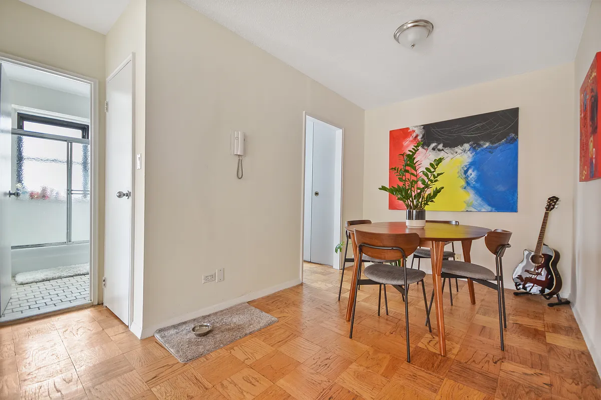 345 East 80th Street, Unit 17J Manhattan, NY 10075 - Photo 5 of 8 a view of a dining room with furniture