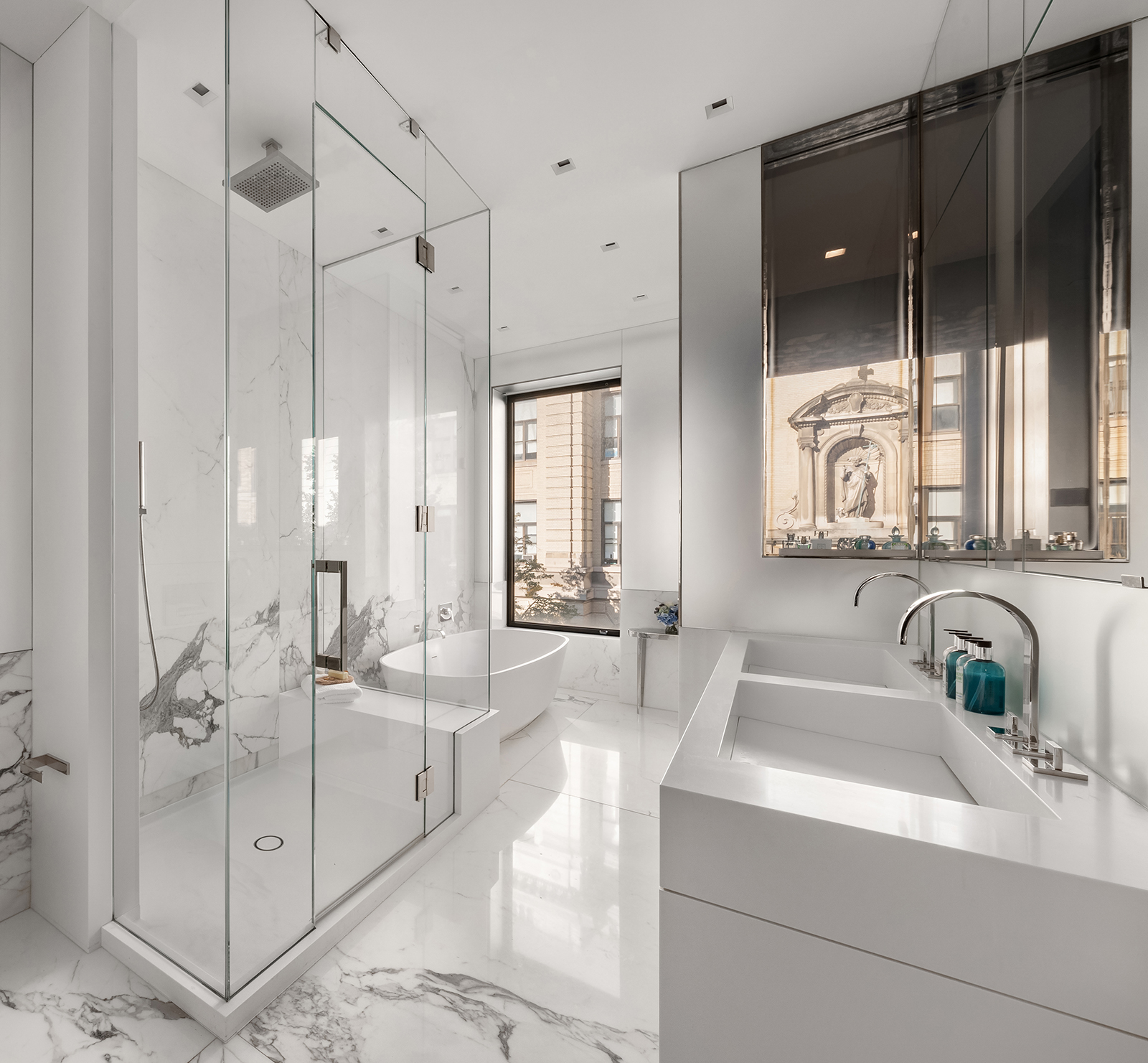 184 East 75th Street Manhattan, NY 10021 - Photo 10 of 20 a bathroom with a double vanity sink mirror and double