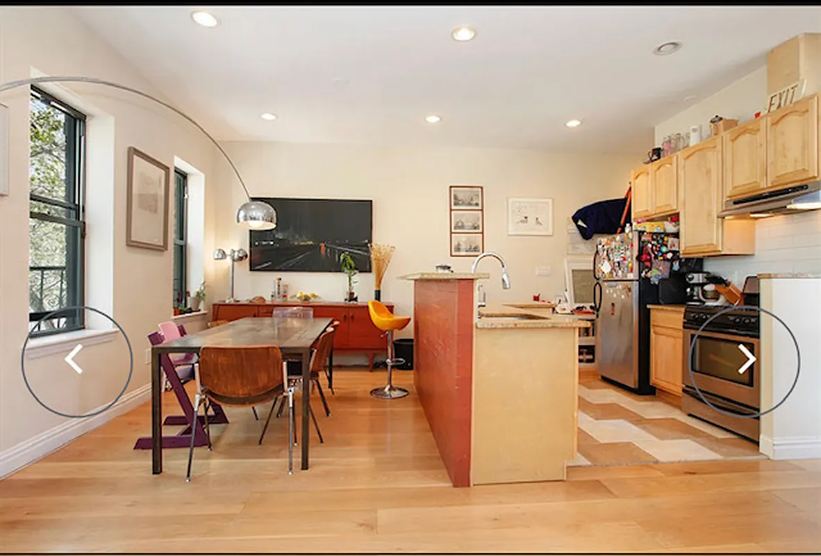 230 Frost Street Brooklyn, NY 11211 - Photo 2 of 17 a living room with furniture a flat screen tv and kitchen view
