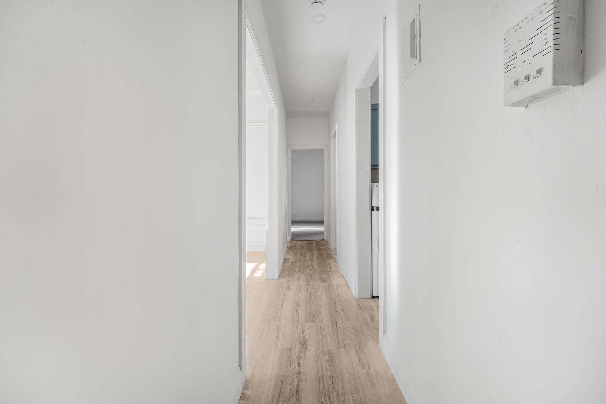 1384 Pacific Street, Unit A2 Brooklyn, NY 11216 - Photo 15 of 16 a view of a hallway with wooden floor