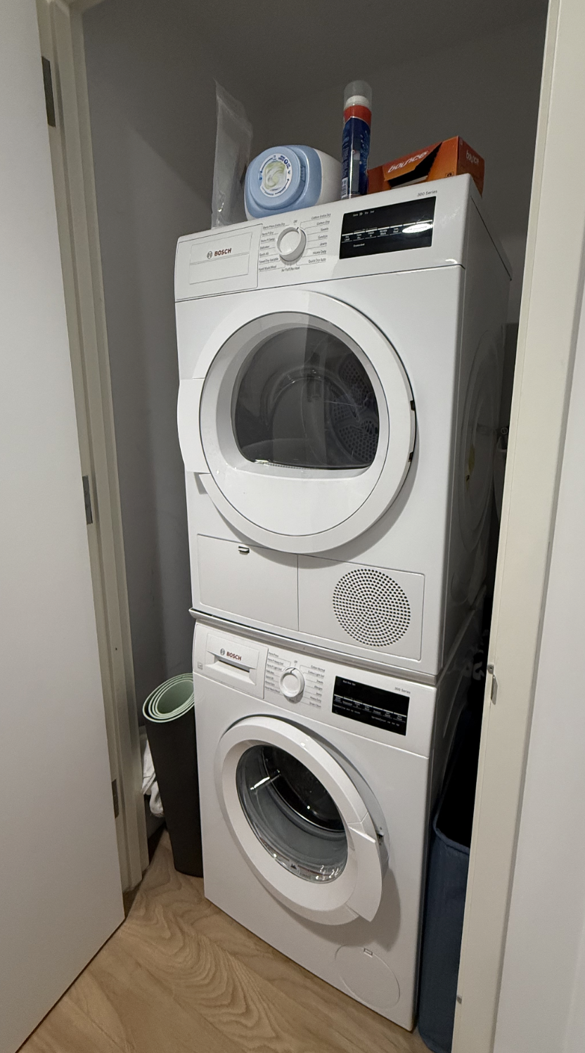 145 Clinton Street, Unit 4N Manhattan, NY 10002 - Photo 5 of 18 a utility room with dryer and washer