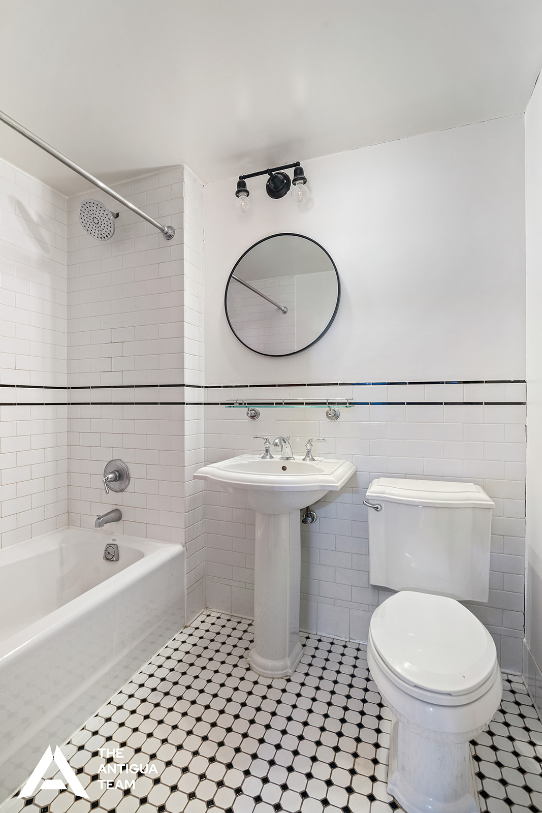 300 West 135th Street, Unit 2M Manhattan, NY 10030 - Photo 6 of 8 a bathroom with a sink toilet a mirror and shower