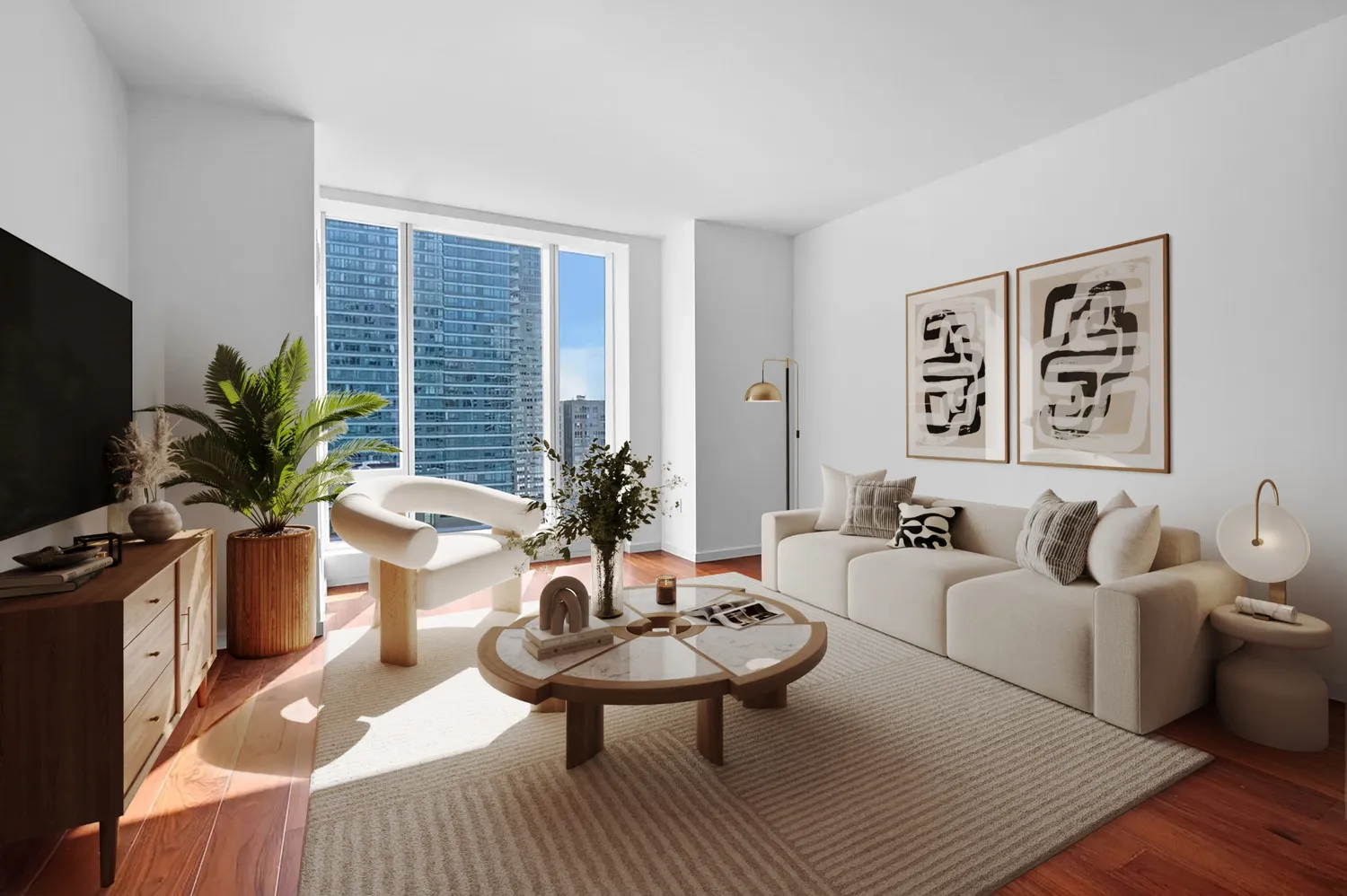 a living room with furniture potted plant and a flat screen tv