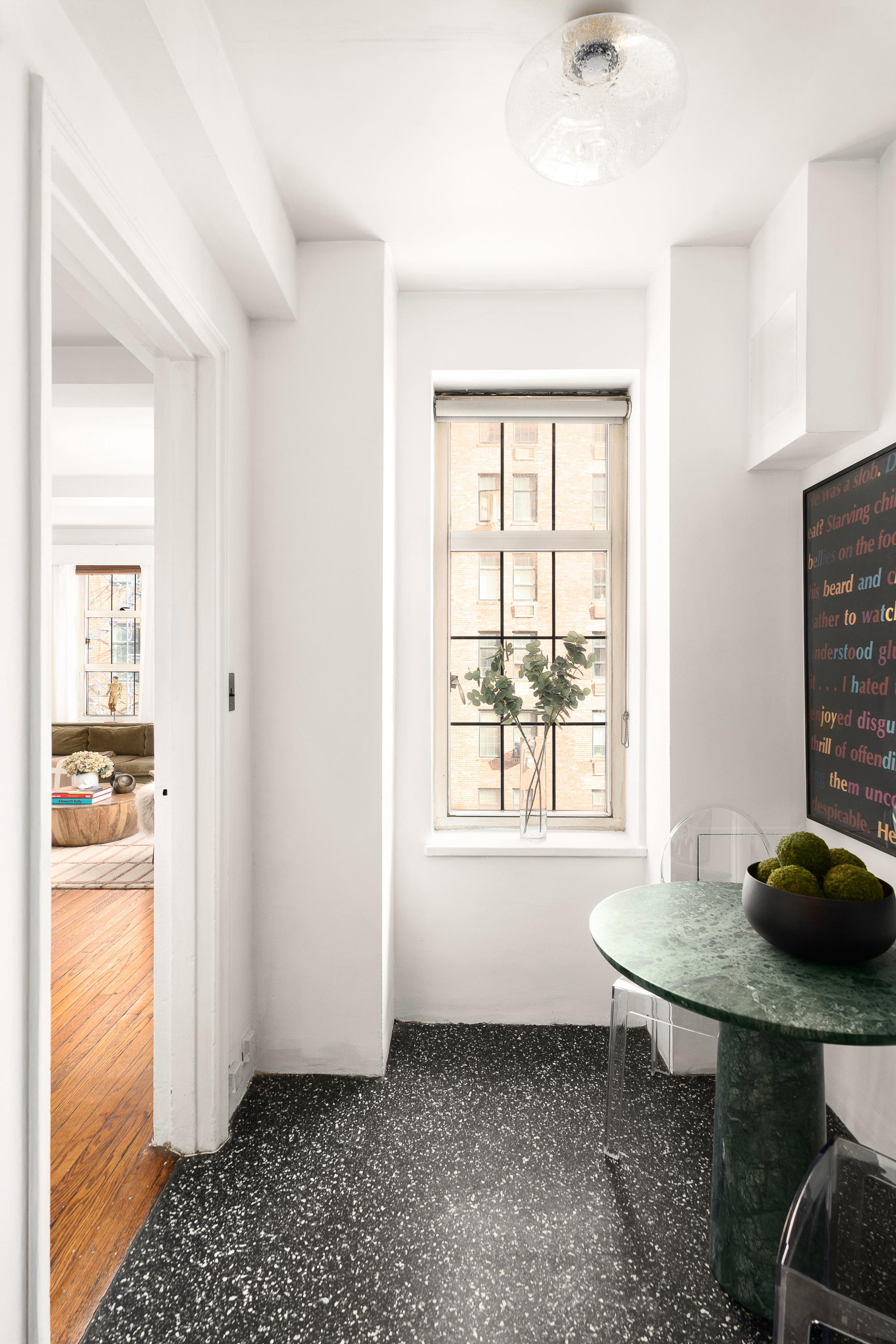 465 West 23rd Street, Unit 10A Manhattan, NY 10011 - Photo 3 of 12 a view of a room that has a bed and a window in it