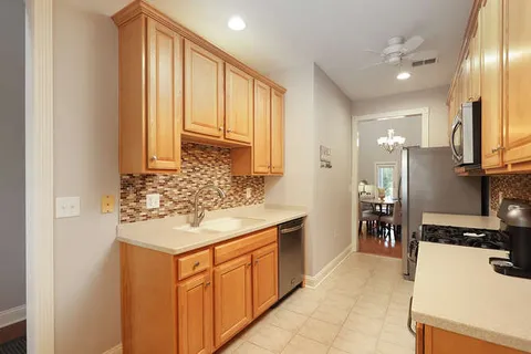 a bathroom with a sink a mirror and a bathtub