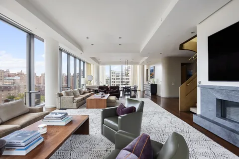 a very nice looking living room with furniture and a flat screen tv