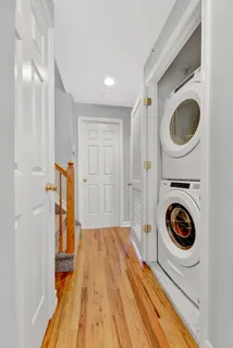 a view of a hallway with washer and dryer