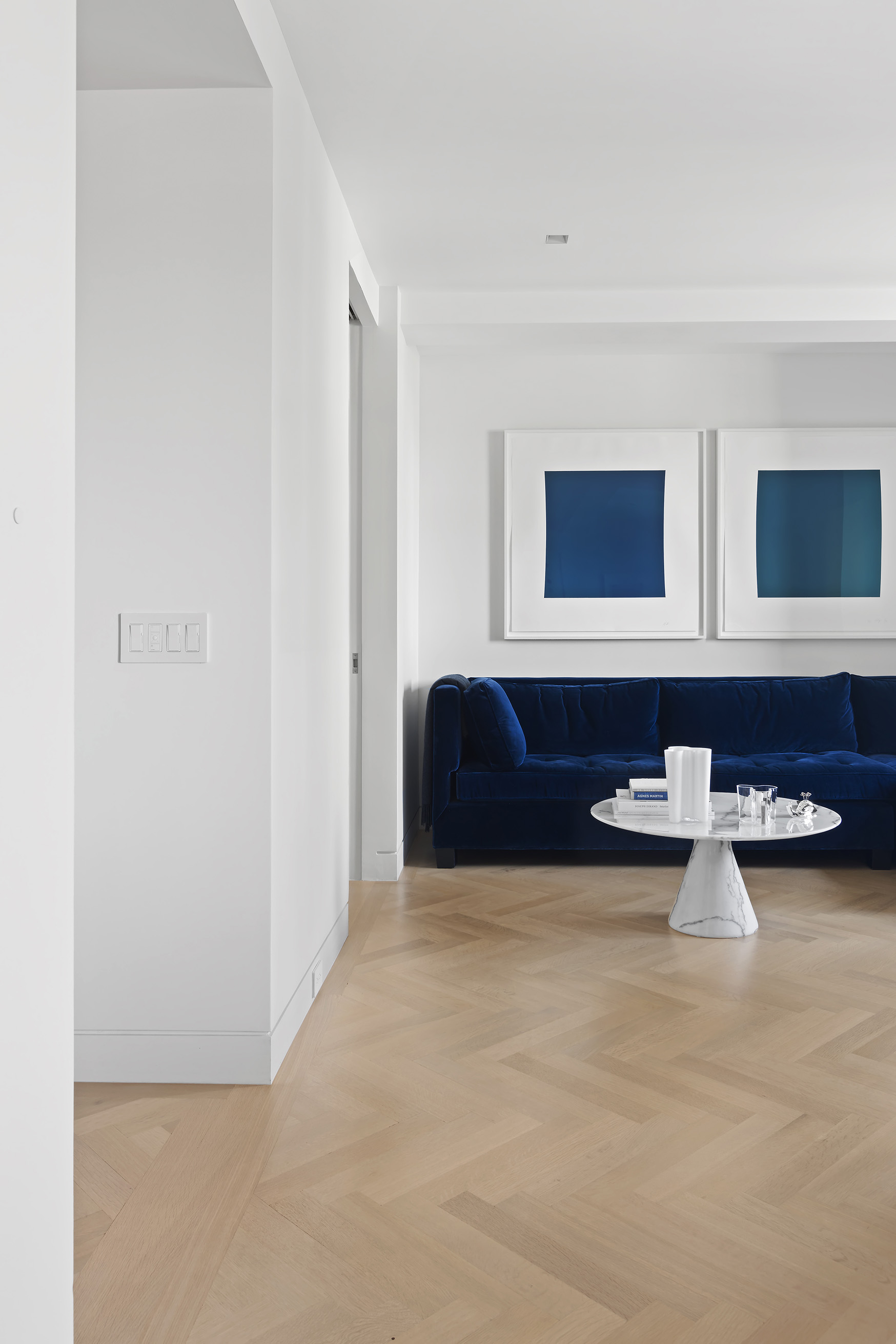 1 5th Avenue, Unit 16F Manhattan, NY 10003 - Photo 12 of 23 a living room with furniture and a night stand