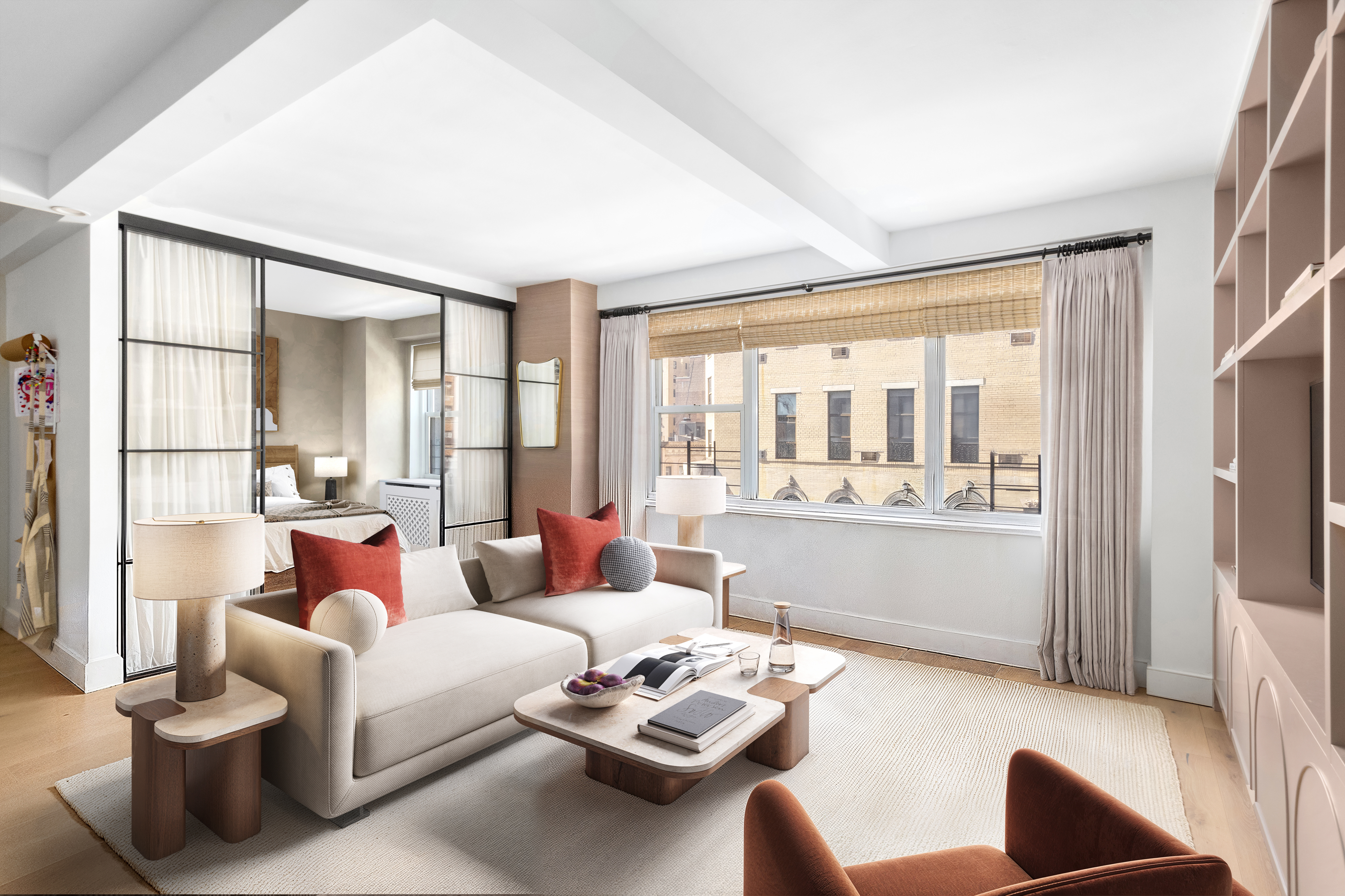 135 East 83rd Street, Unit 8/9C Manhattan, NY 10028 - Photo 2 of 15 a living room with furniture and a large window with outer view