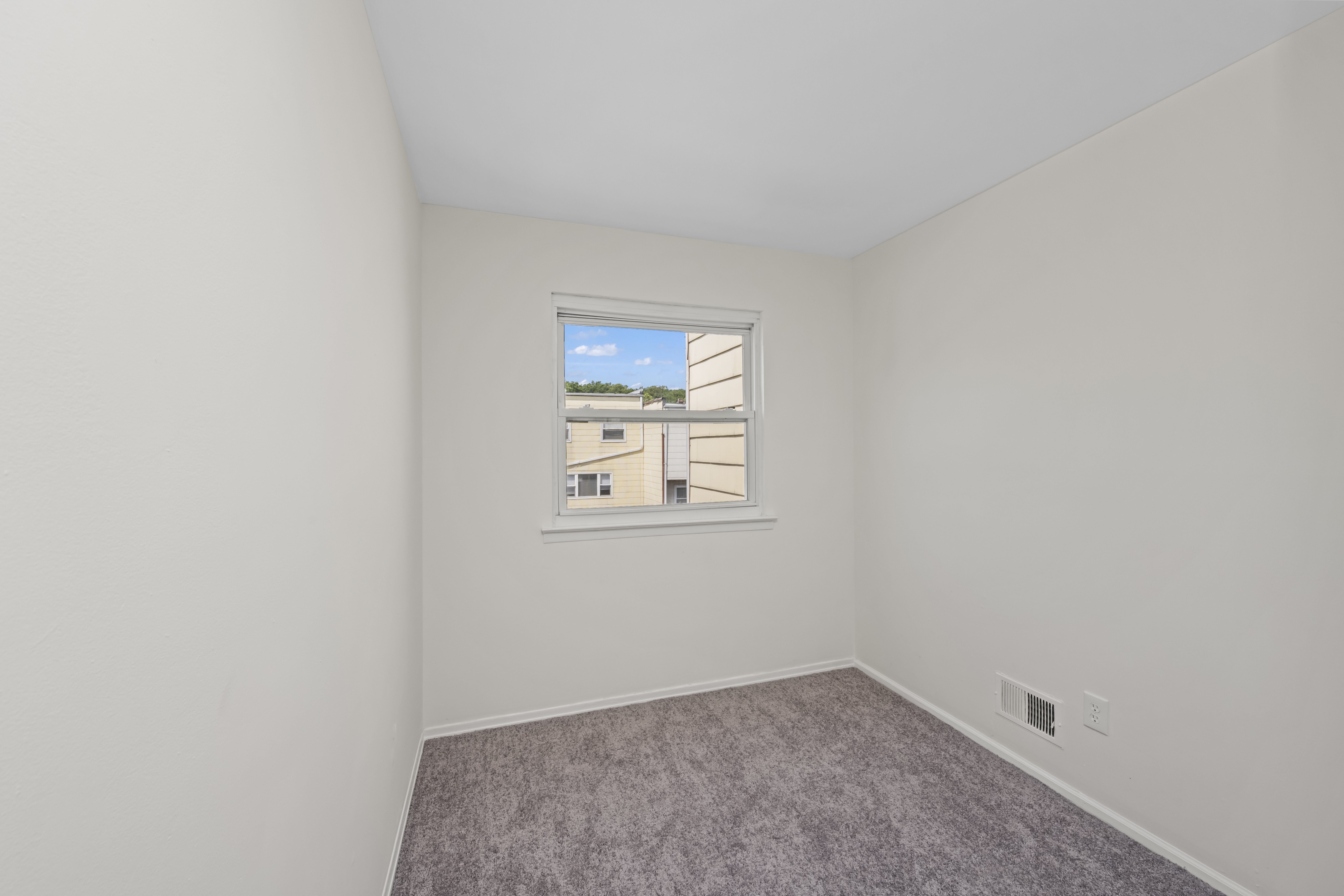 12 Yucca Drive Staten Island, NY 10312 - Photo 12 of 21 an empty room with windows