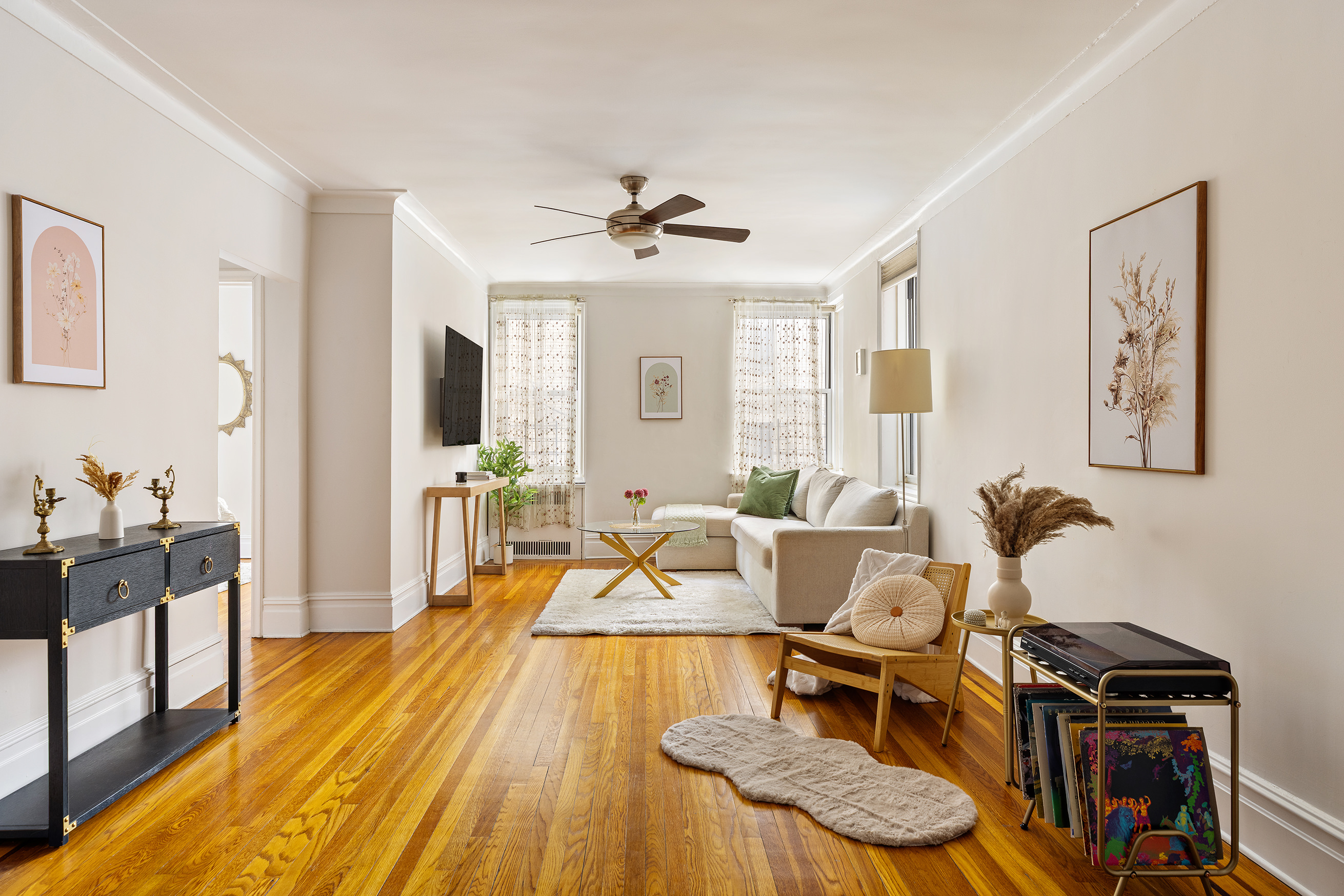 45 Plaza Street West, Unit 1F Brooklyn, NY 11217 - Photo 1 of 10 a living room with furniture and a wooden floor