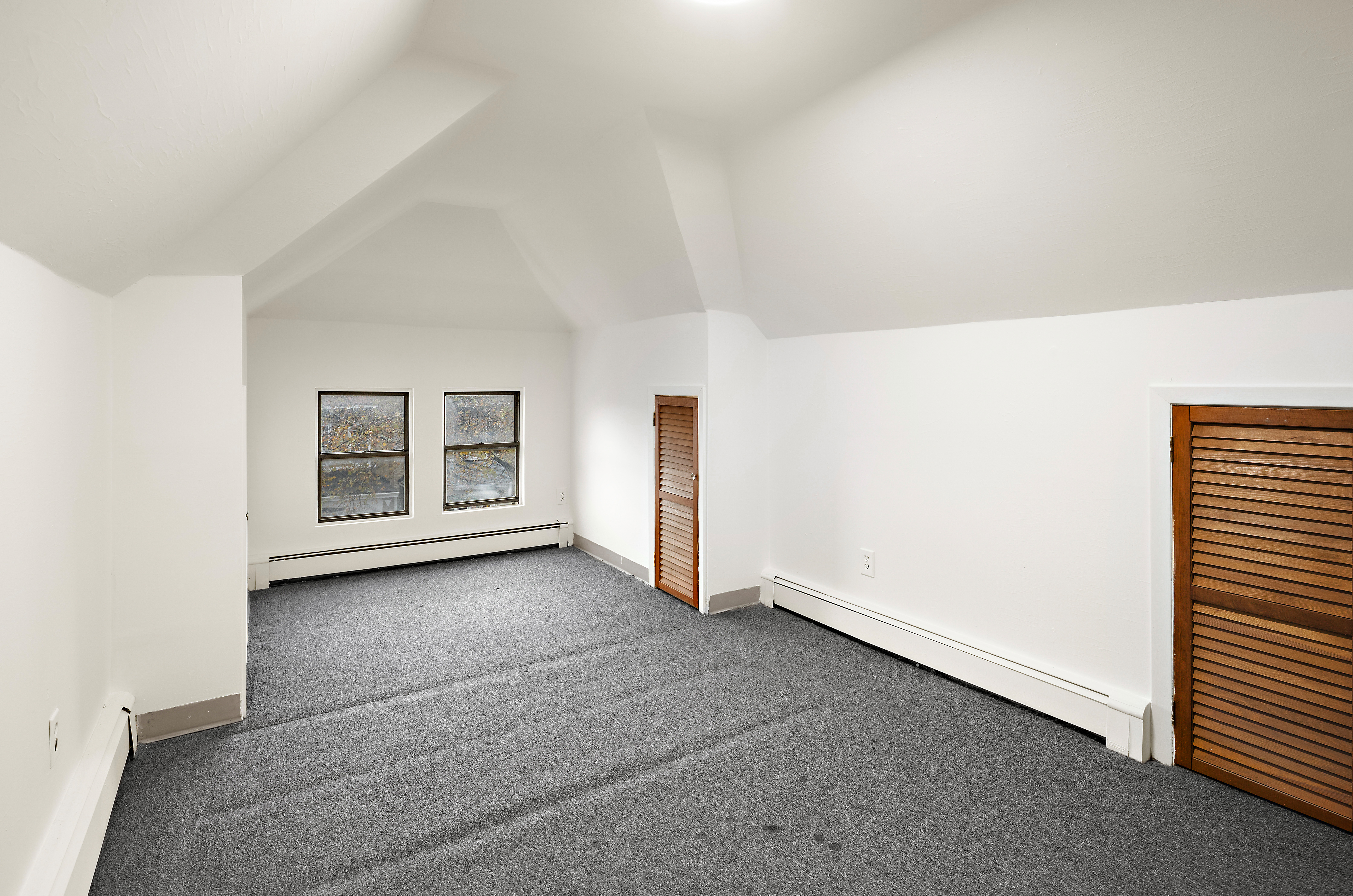 562 84th Street Brooklyn, NY 11209 - Photo 20 of 25 an empty room with windows