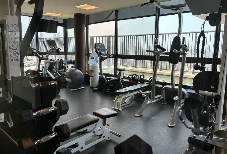 171 East 84th Street, Unit 22C Manhattan, NY 10028 - Photo 15 of 17 a view of a room with gym equipment