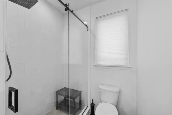 a bathroom with a toilet and a sink