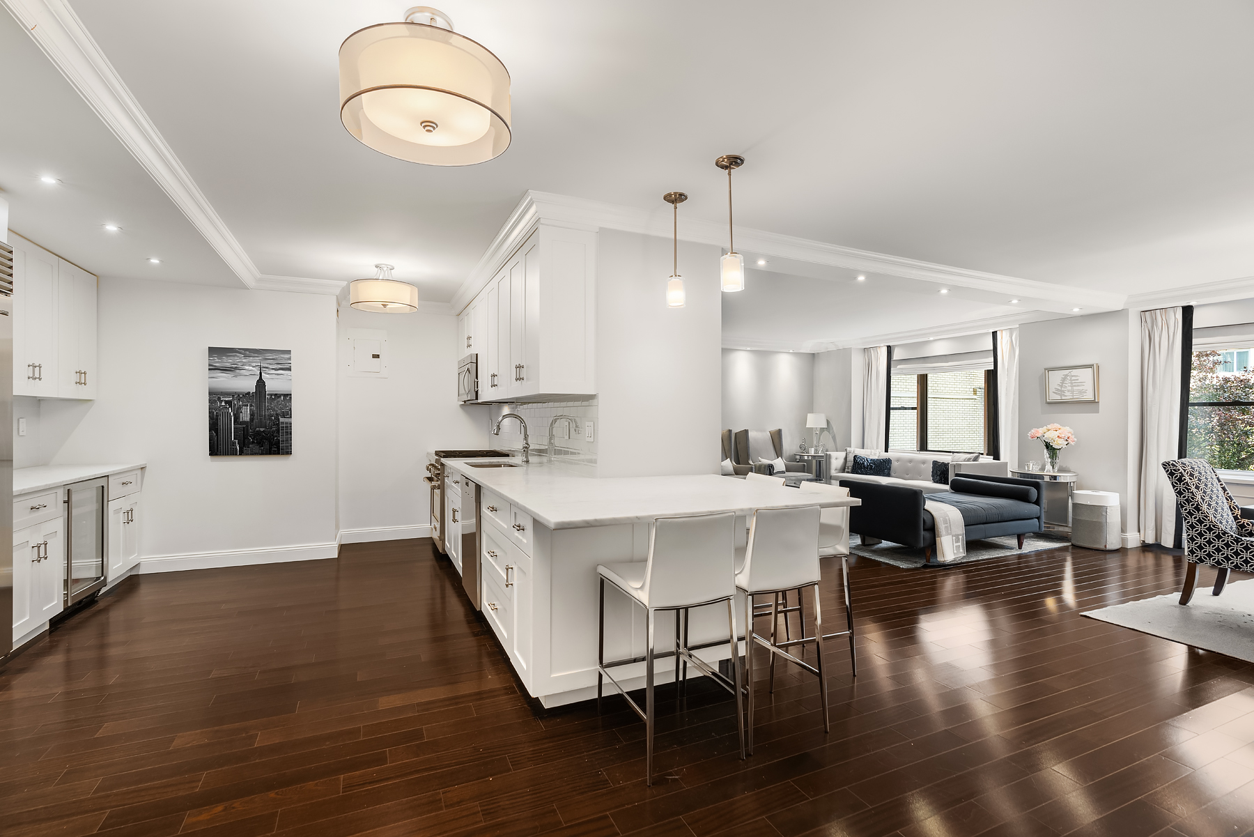 178 East 80th Street, Unit 3A Manhattan, NY 10075 - Photo 3 of 14 a large white kitchen with lots of counter space and furniture