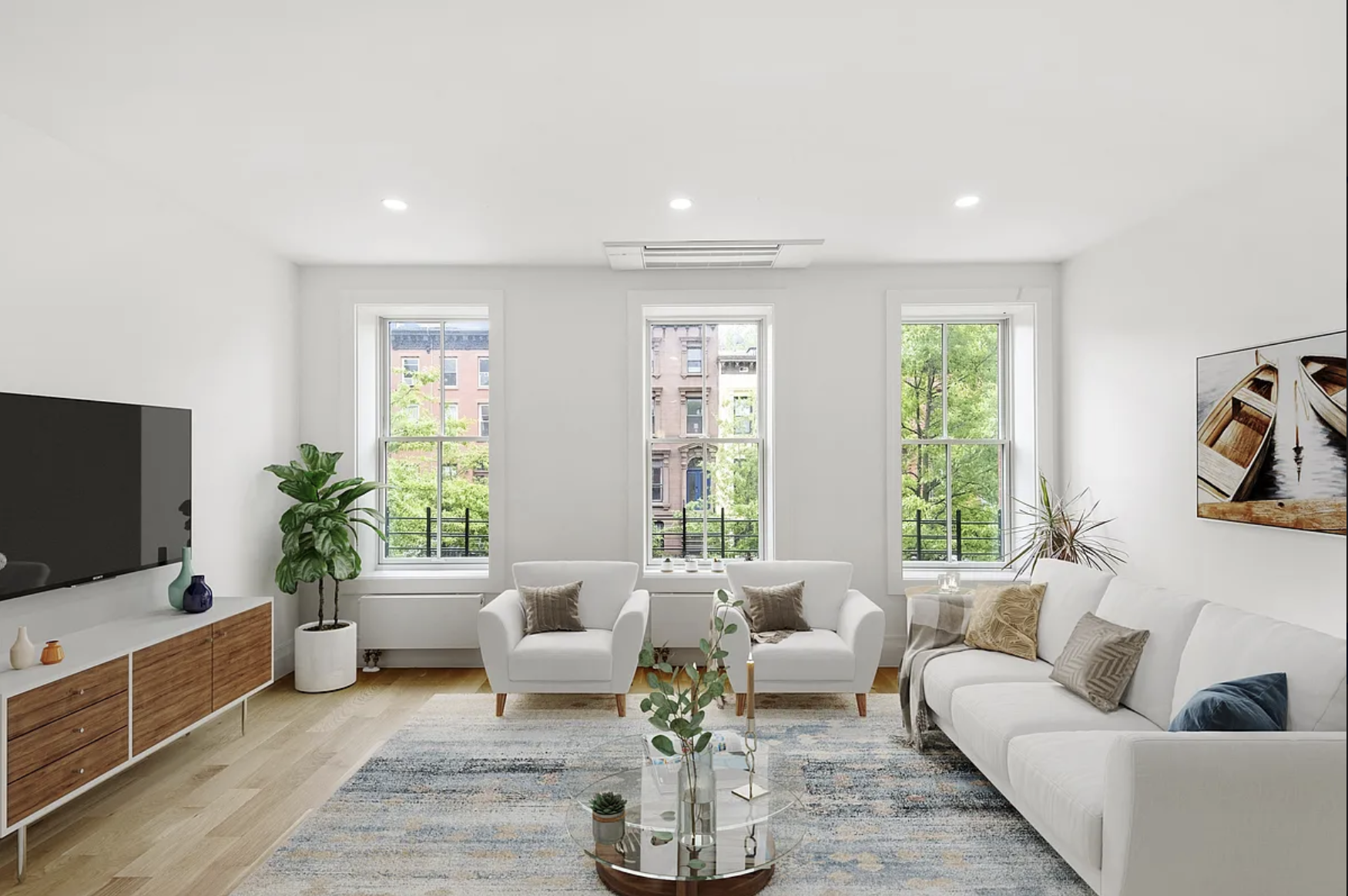 a living room with furniture and a flat screen tv