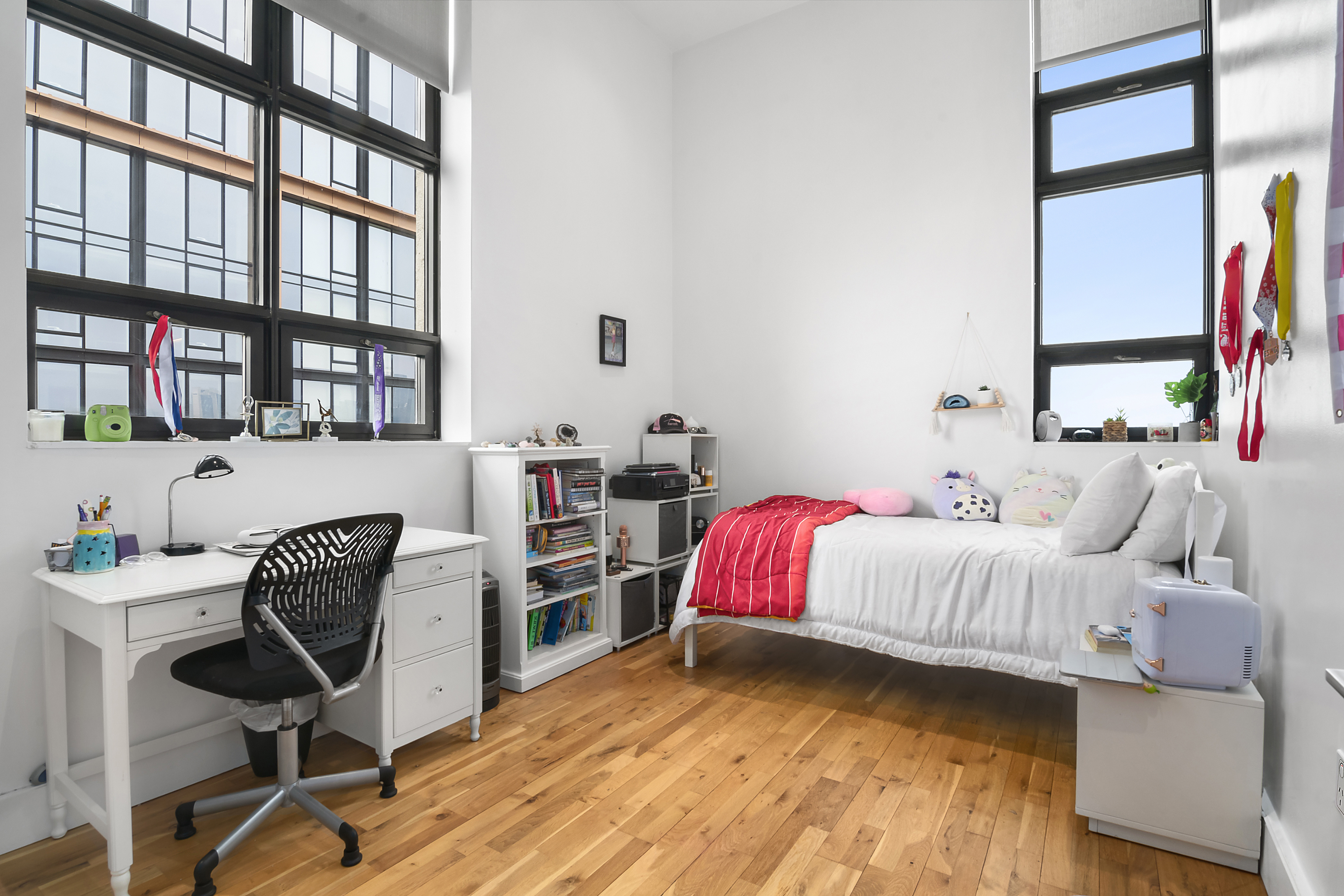 360 Furman Street, Unit 1036 Brooklyn, NY 11201 - Photo 6 of 45 a bedroom with a bed and a chair