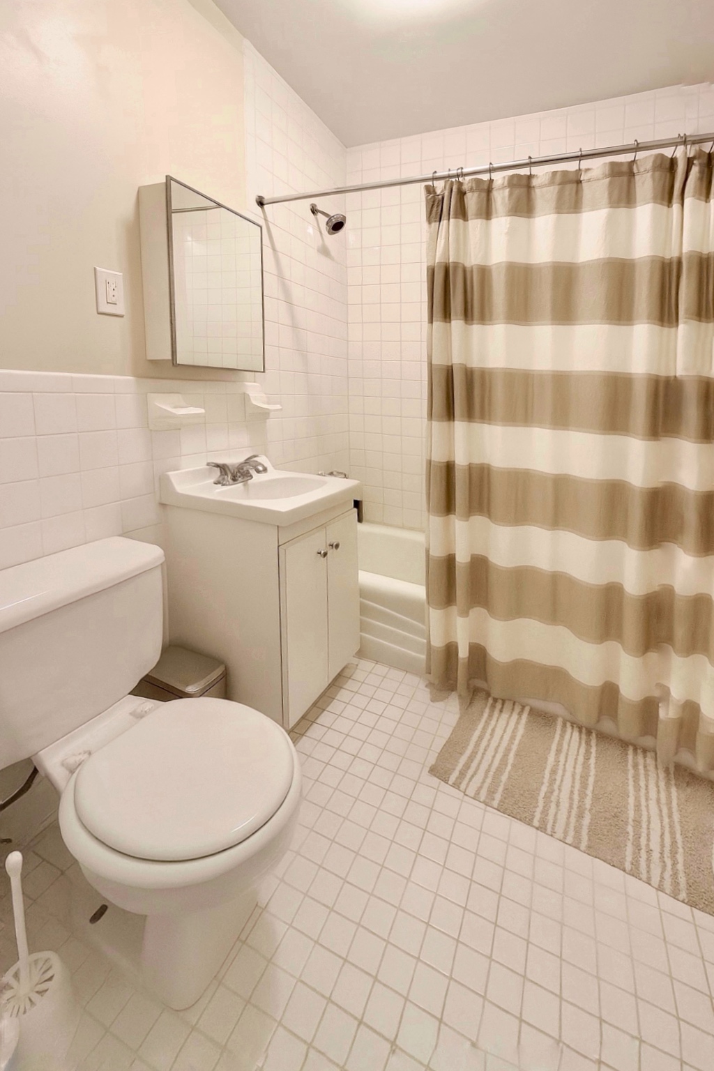 169 Allen Street, Unit 5C Manhattan, NY 10002 - Photo 7 of 11 a bathroom with a sink toilet and shower
