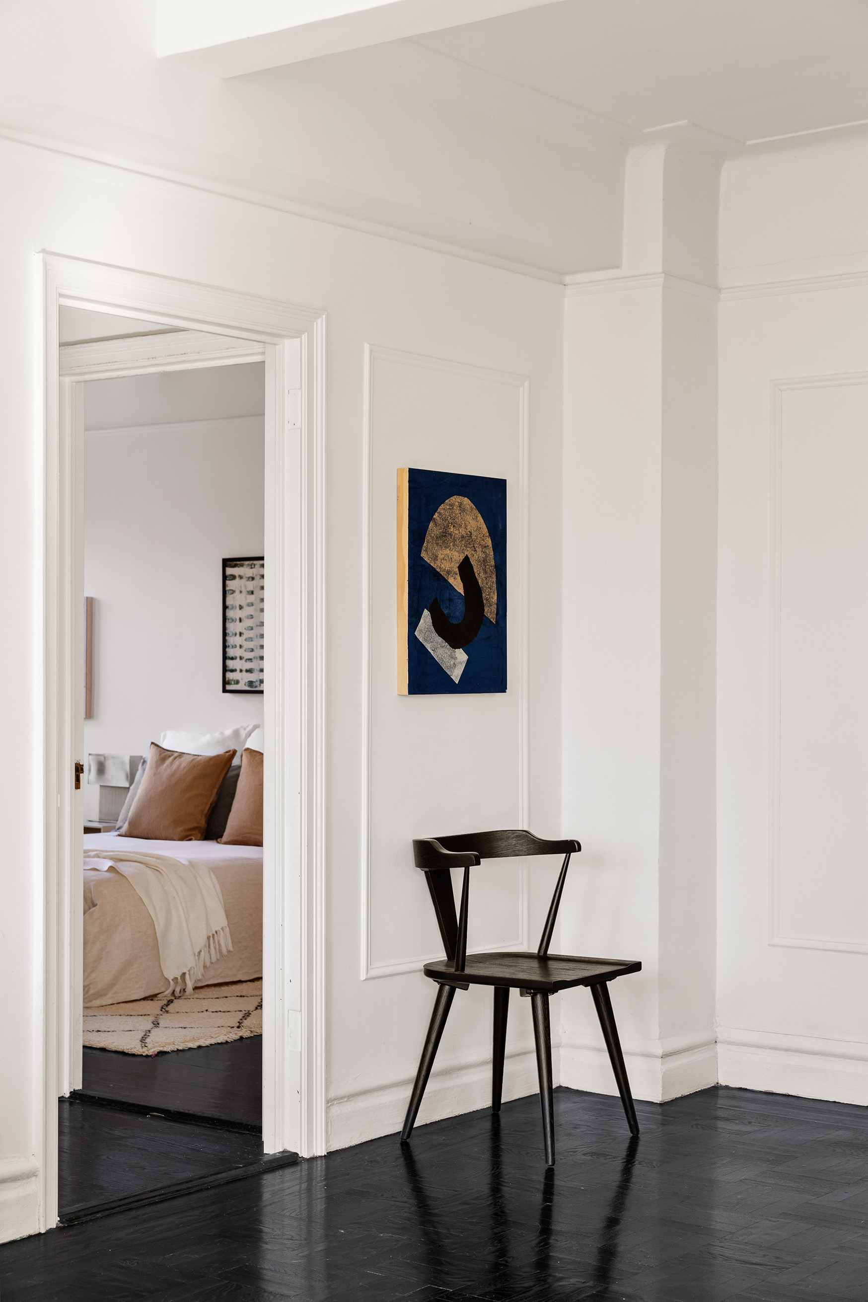 141 East 3rd Street, Unit 5H Manhattan, NY 10009 - Photo 9 of 12 a bedroom with bed and a couch