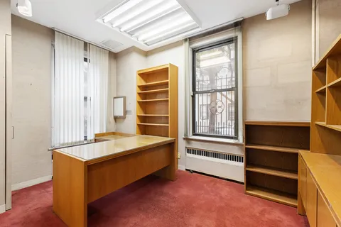 a room with cabinets and window