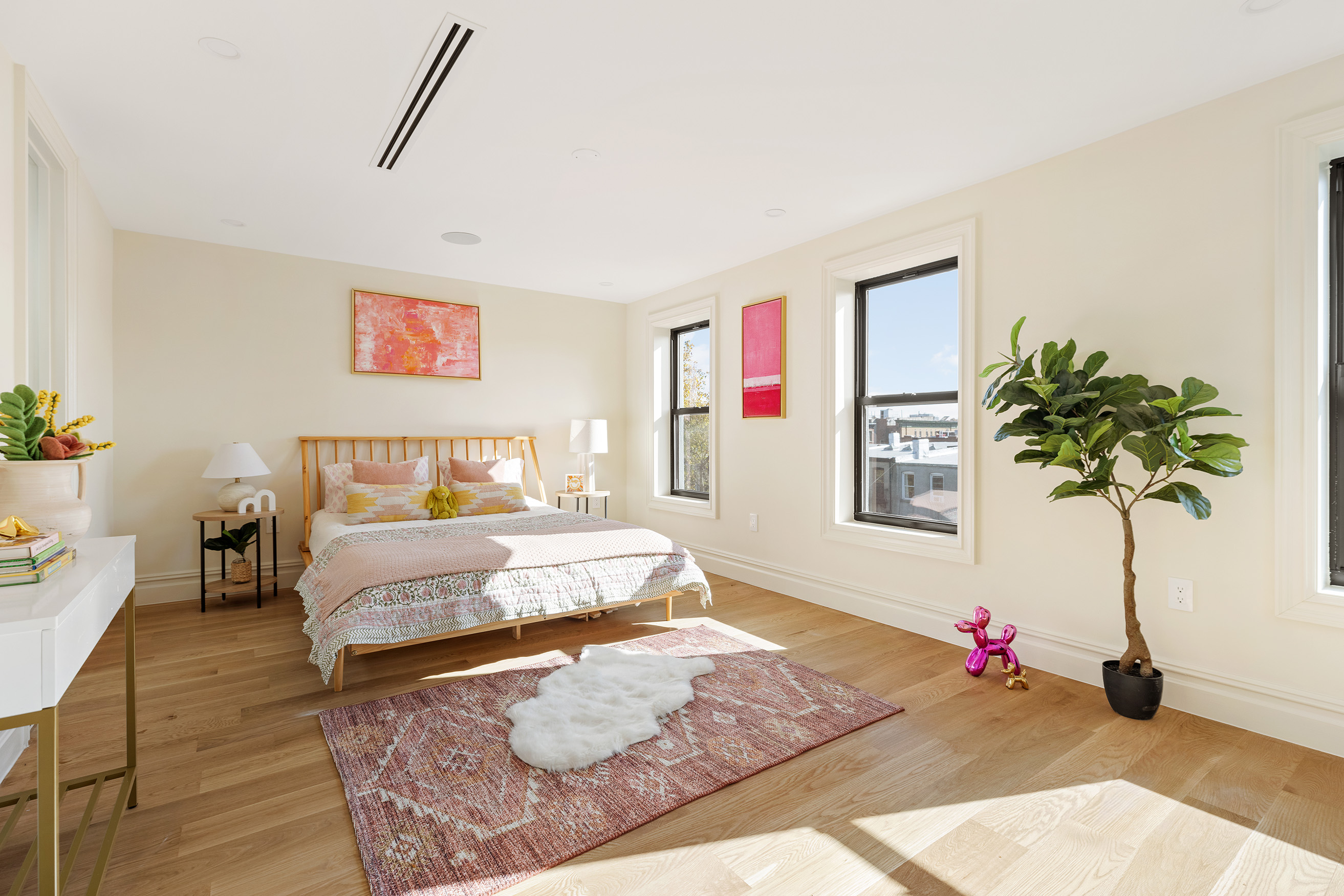 198 Madison Street, Unit SF Brooklyn, NY 11216 - Photo 9 of 19 a bedroom with furniture and a potted plant