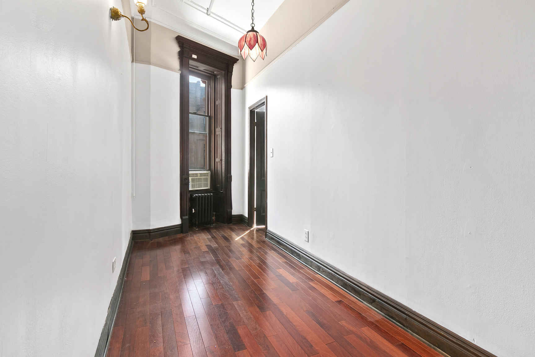 7 West 122nd Street, Unit 3 Manhattan, NY 10027 - Photo 4 of 6 a view of a room with wooden floor
