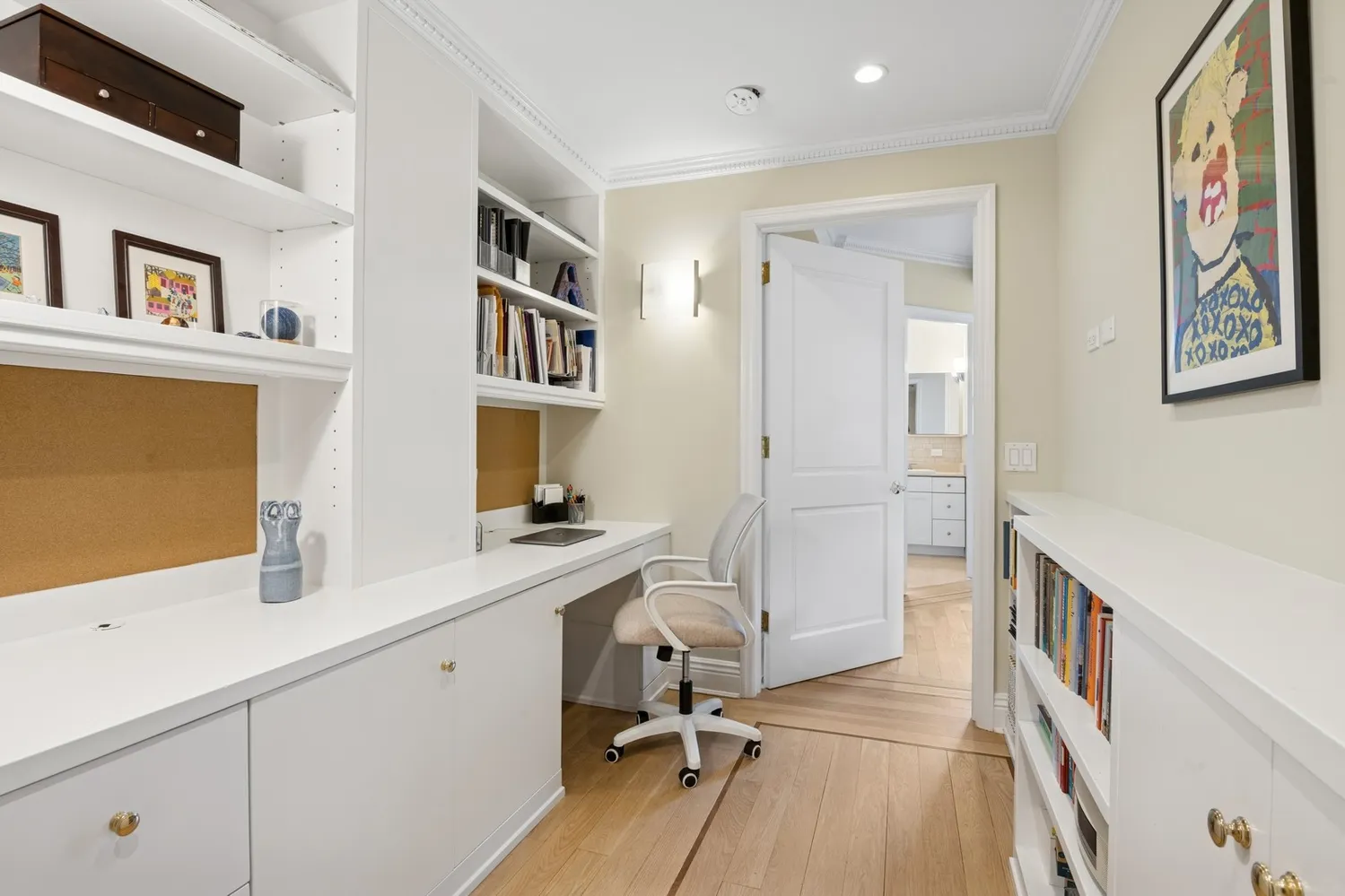 a room with a sink and a refrigerator