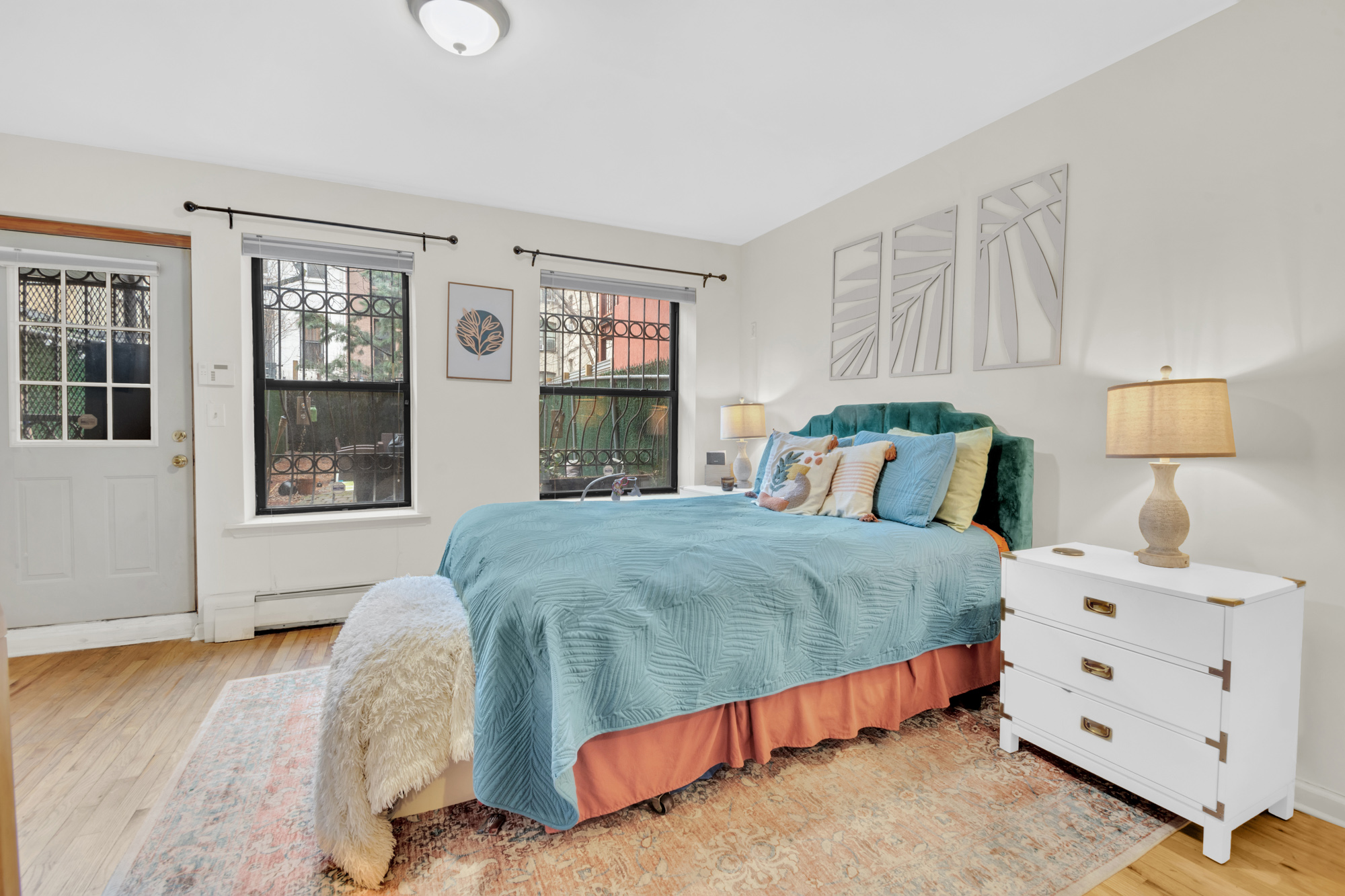 137 West 126th Street, Unit 1 Manhattan, NY 10027 - Photo 6 of 12 a bedroom with a bed and window